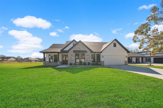 view of front of property featuring a front yard and a garage