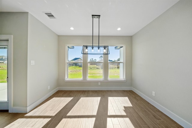 unfurnished dining area featuring light hardwood / wood-style flooring