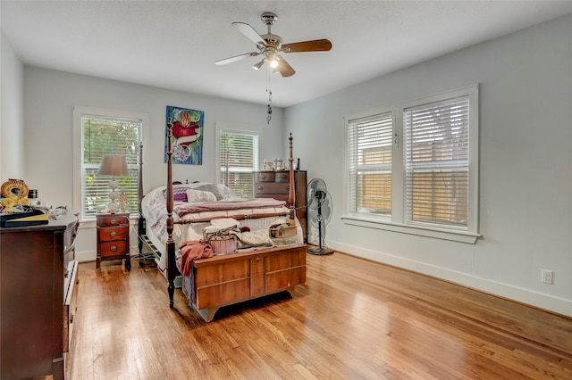 bedroom featuring ceiling fan and light hardwood / wood-style flooring