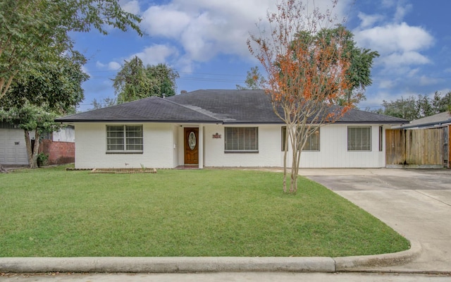 ranch-style home with a front lawn