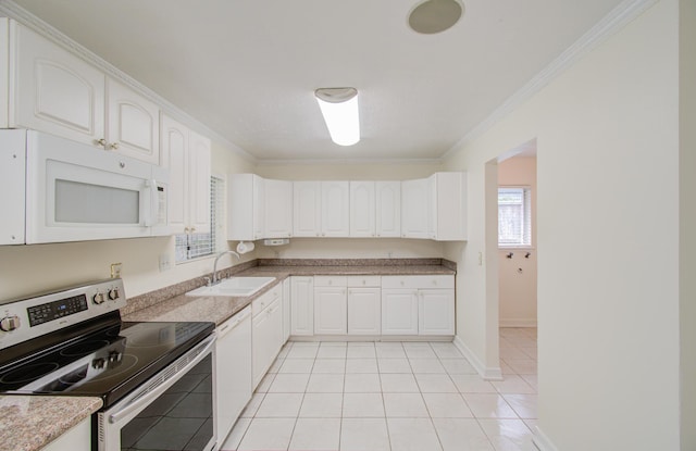 kitchen featuring white cabinets, plenty of natural light, white appliances, and sink