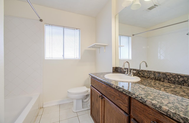 full bathroom featuring toilet, plenty of natural light, vanity, and tile patterned flooring