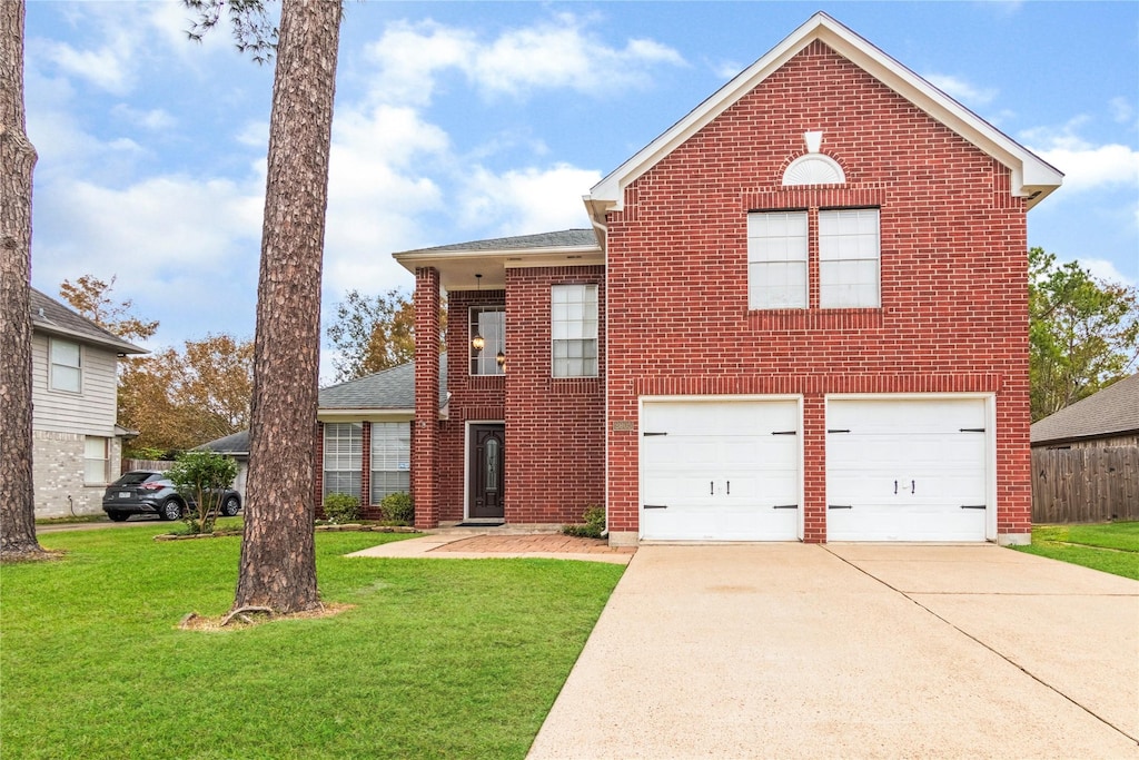 front of property featuring a front lawn and a garage