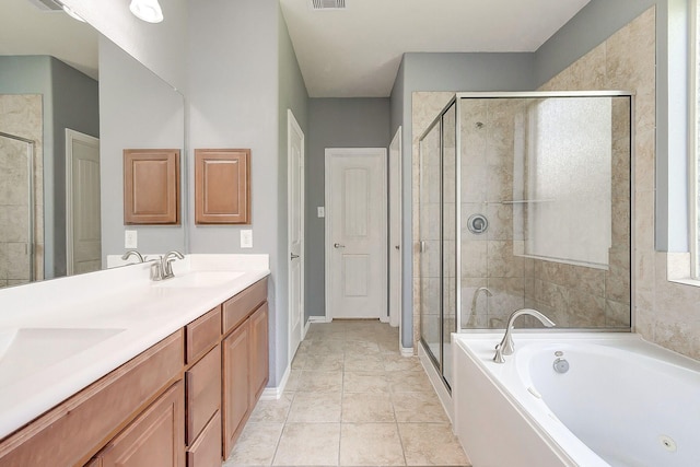 bathroom featuring vanity, tile patterned floors, and independent shower and bath