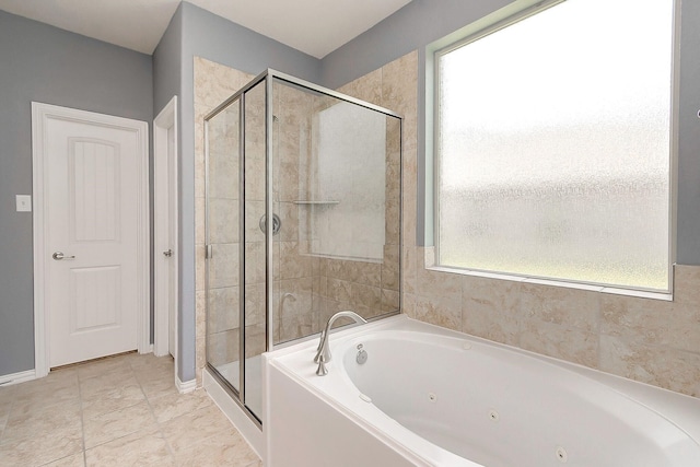 bathroom with separate shower and tub