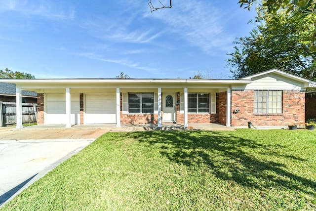 ranch-style house with covered porch, a garage, and a front lawn