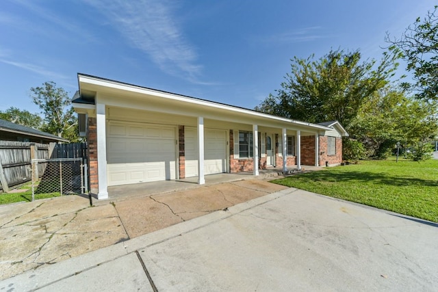 single story home with covered porch and a front yard