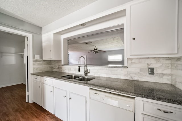 kitchen featuring white cabinets, a textured ceiling, sink, dishwasher, and dark hardwood / wood-style floors