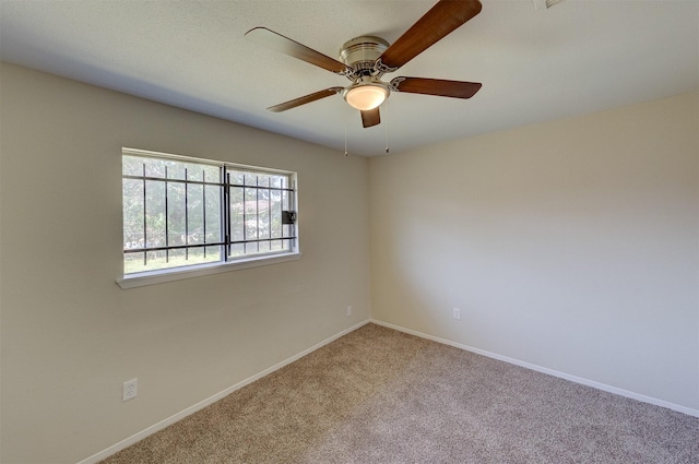 carpeted empty room with ceiling fan