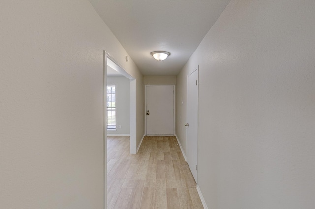 corridor featuring light hardwood / wood-style flooring