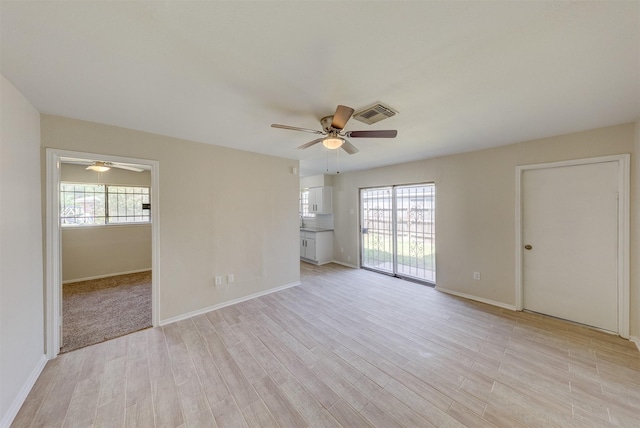 unfurnished room featuring ceiling fan and light hardwood / wood-style floors