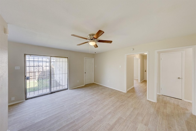 spare room featuring ceiling fan and light wood-type flooring