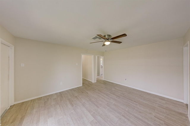 unfurnished room featuring ceiling fan and light hardwood / wood-style flooring