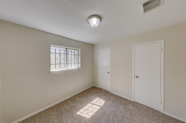 unfurnished bedroom with carpet