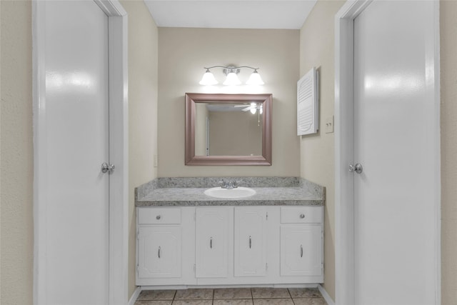 bathroom with tile patterned floors and vanity