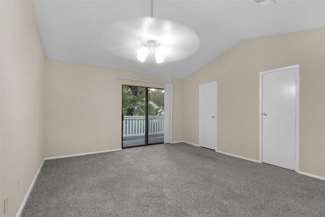 empty room with ceiling fan and lofted ceiling