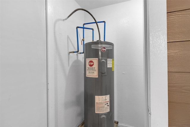 utility room featuring electric water heater