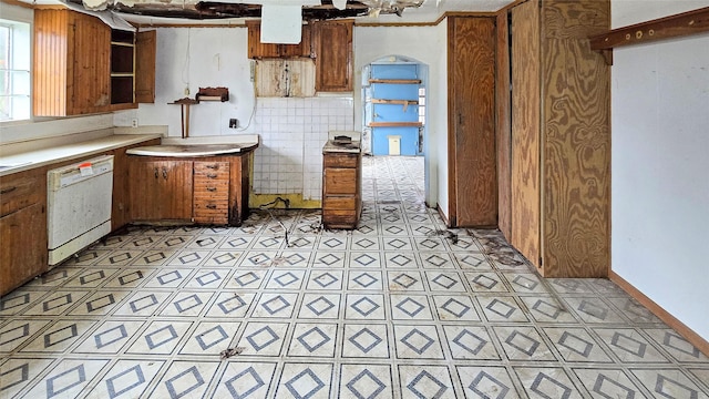 kitchen featuring dishwasher and backsplash