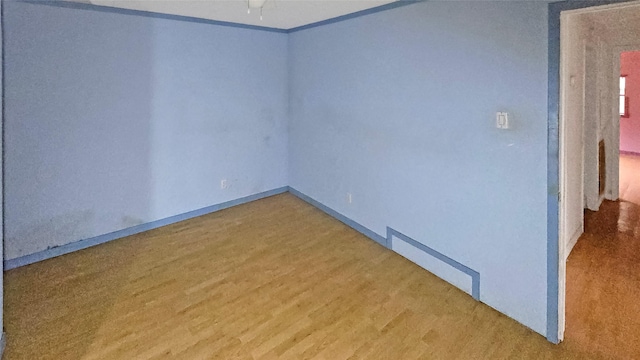 spare room with hardwood / wood-style floors