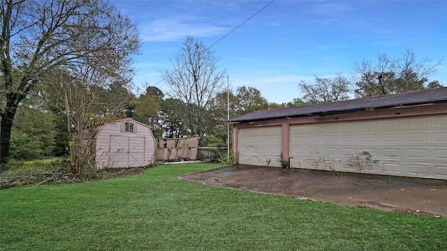 garage with a yard