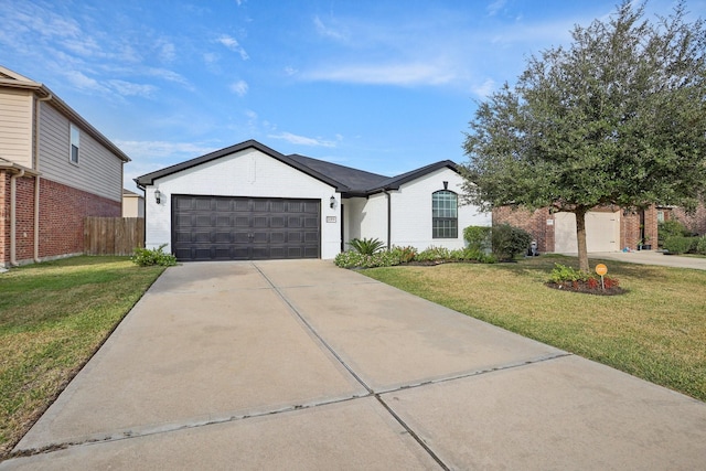 single story home featuring a front yard and a garage