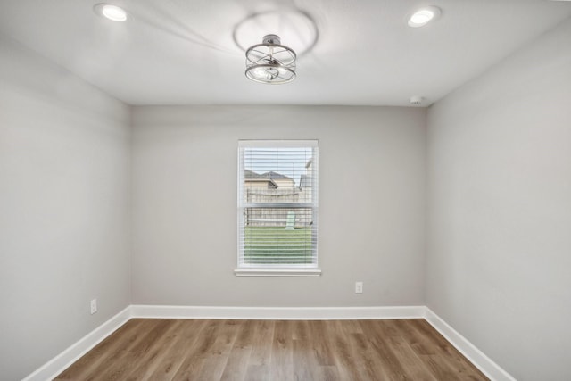 spare room featuring hardwood / wood-style flooring