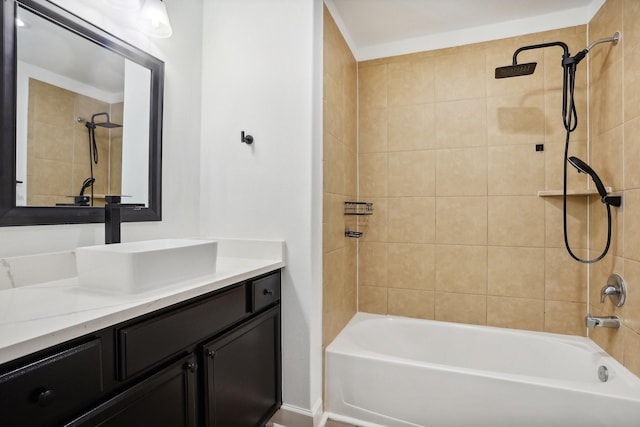 bathroom with vanity and tiled shower / bath