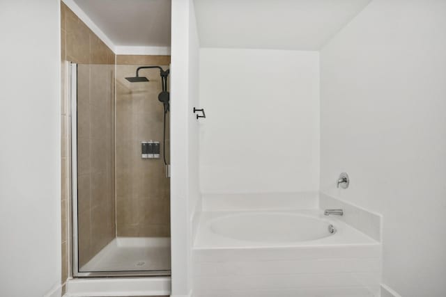 bathroom featuring plus walk in shower