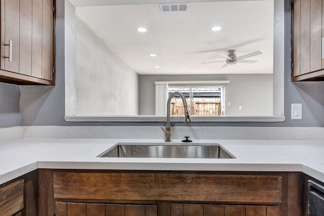 kitchen with ceiling fan, sink, and dishwasher