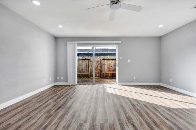 empty room featuring ceiling fan and light wood-type flooring