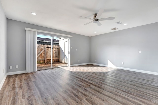 empty room featuring ceiling fan and hardwood / wood-style floors