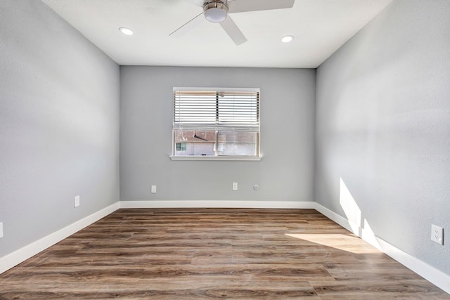 unfurnished room with ceiling fan and hardwood / wood-style floors