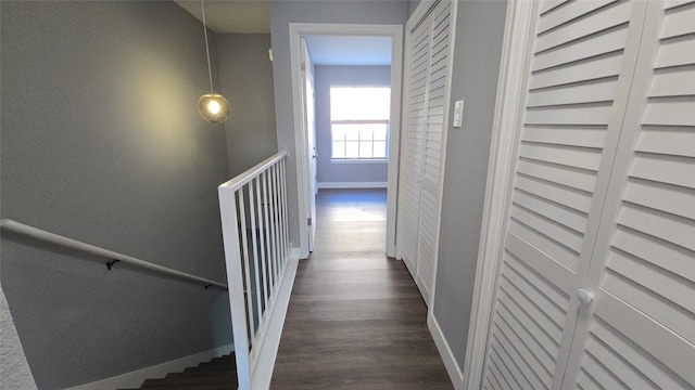 corridor featuring dark wood-type flooring