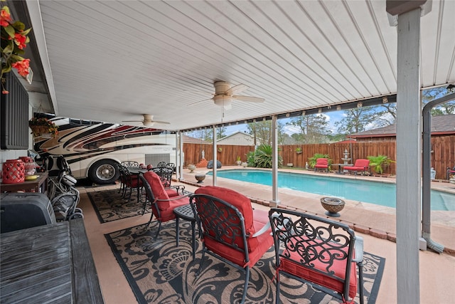 view of swimming pool with ceiling fan