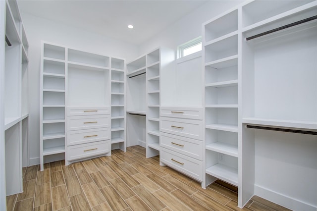 walk in closet with light wood-type flooring