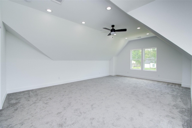 additional living space featuring carpet floors, ceiling fan, and lofted ceiling