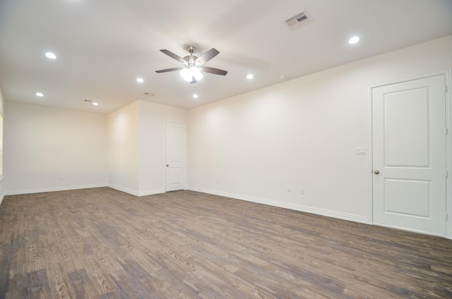 empty room featuring dark hardwood / wood-style floors and ceiling fan