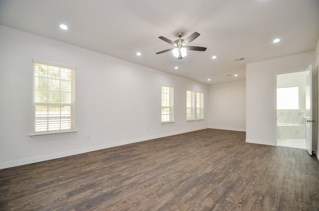 unfurnished room featuring dark hardwood / wood-style floors and ceiling fan