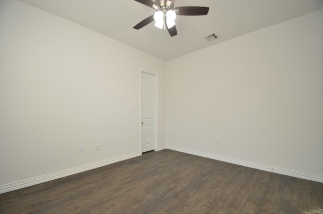 unfurnished room with ceiling fan and dark hardwood / wood-style flooring