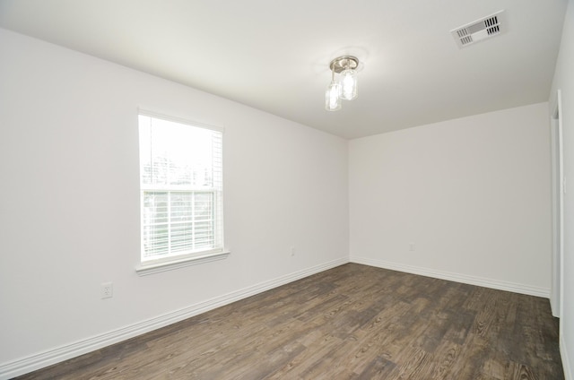 unfurnished room featuring dark hardwood / wood-style floors