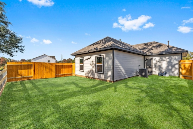 rear view of house with a lawn