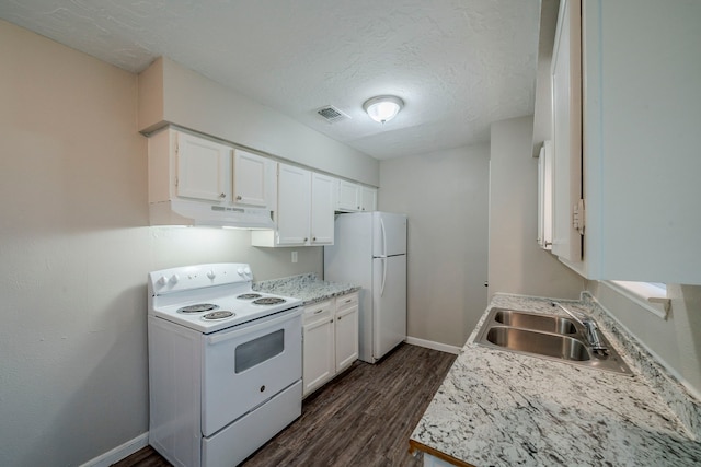 kitchen with white appliances, dark wood-type flooring, white cabinets, sink, and a textured ceiling