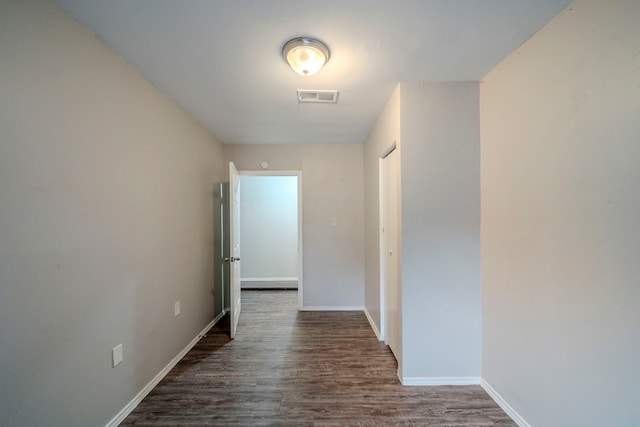 hallway featuring dark hardwood / wood-style floors