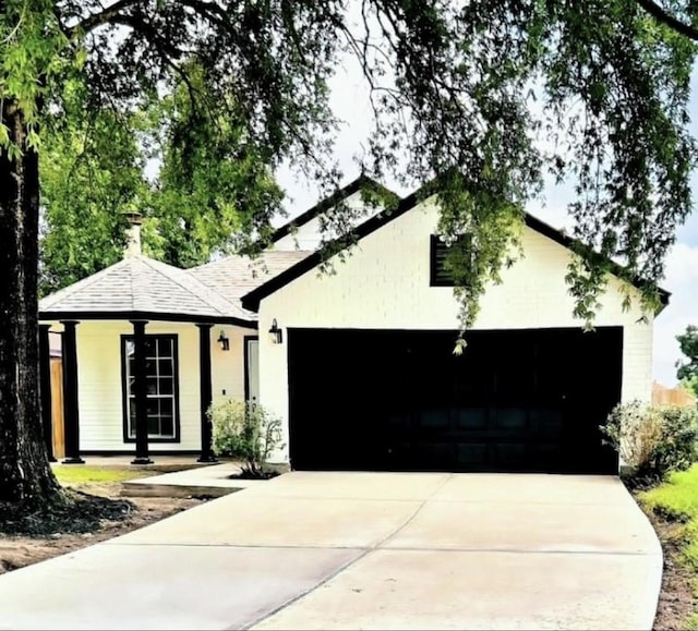 view of front of house with a porch and a garage