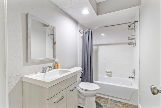 full bathroom featuring vanity, toilet, shower / bathtub combination with curtain, and a textured ceiling