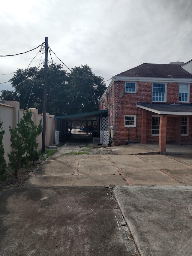 view of home's exterior featuring a carport