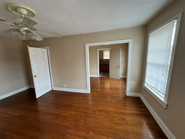 2011 Binz St Unit 8, Houston, TX 77004 - spare room featuring a textured ceiling, a ceiling fan, and wood finished floors