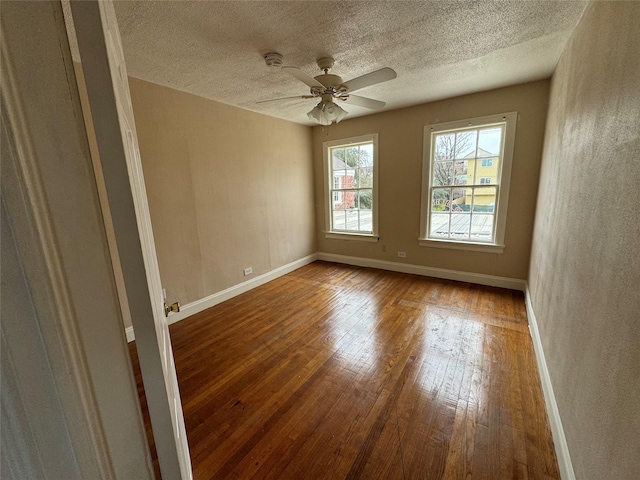2011 Binz St Unit 8, Houston, TX 77004 - spare room with hardwood / wood-style floors, a textured ceiling, a ceiling fan, and a smoke detector
