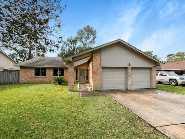 view of front of property with a garage and a front yard