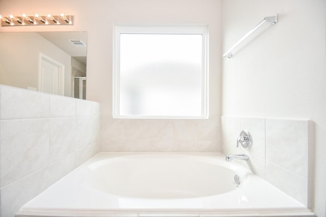 bathroom featuring a washtub